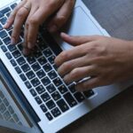 Corporate Social - Man working on laptop in office