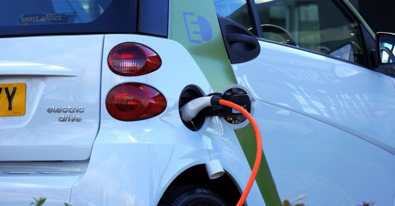 Electric Vehicles - White and Orange Gasoline Nozzle