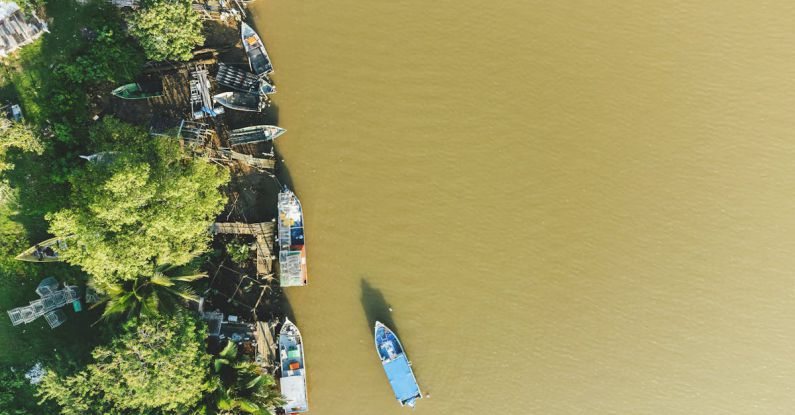 Green Transportation - An aerial view of a fishing boat near a jetty at Dungun, Terengganu.